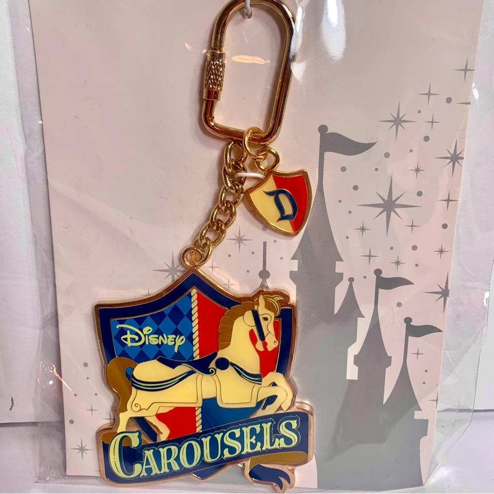 NWT. Disney carousels keychain or bag charm. Large metal gold tone key chain